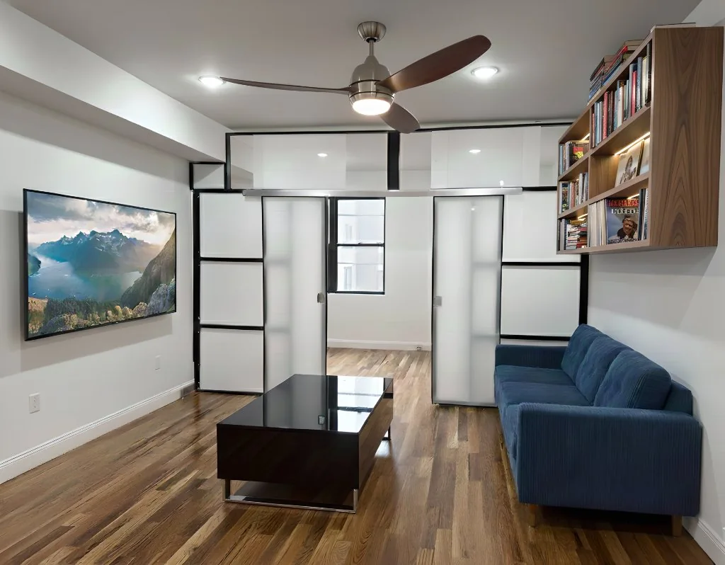 NYC apartment living room with 1W2R white modular freestanding wall panel system, floor-to-ceiling, no drilling