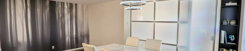 Freestanding room divider with a sliding door creating a private bedroom in an apartment