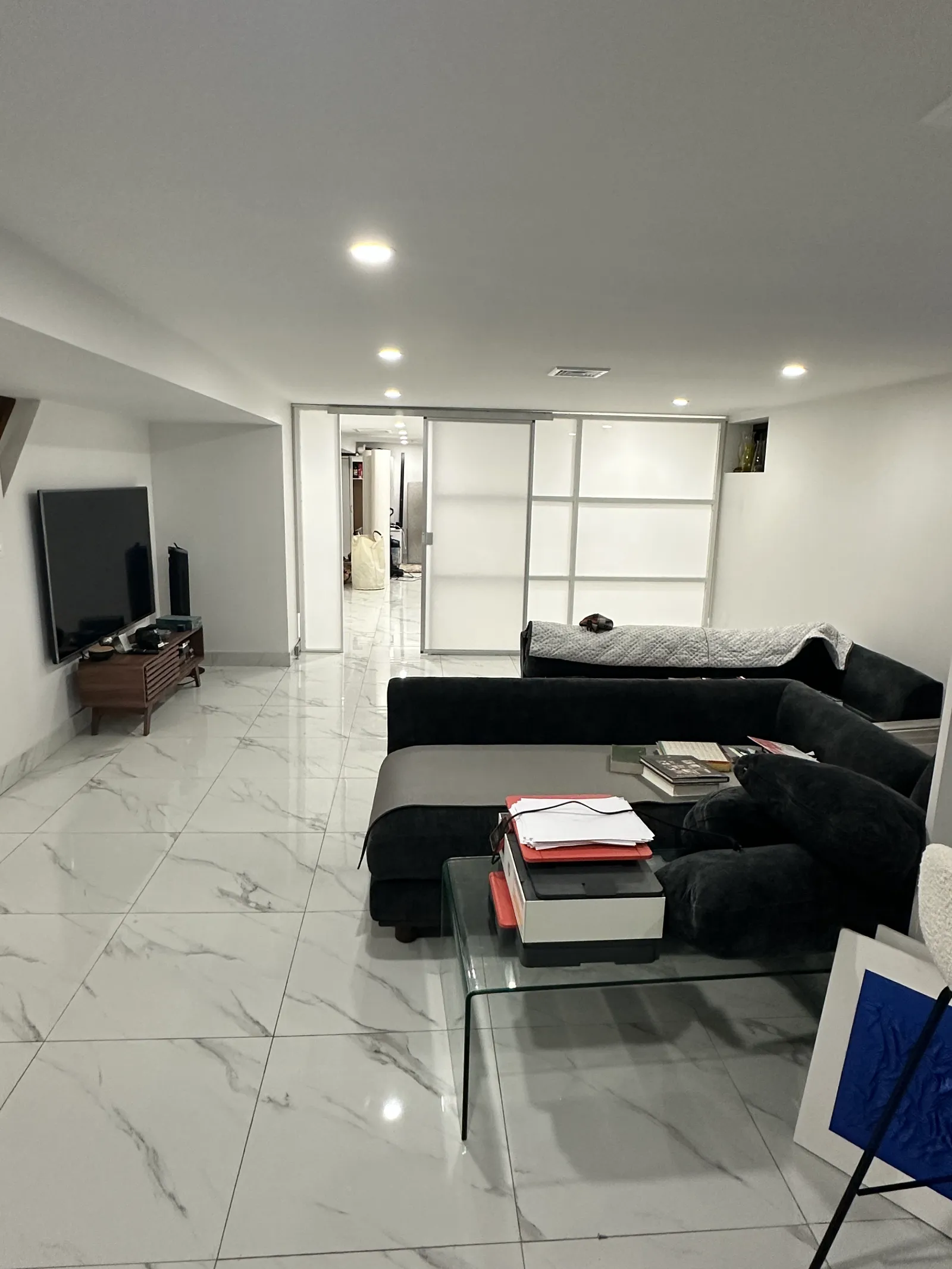 Basement after installing a freestanding room divider with sliding door &mdash; a private room created without construction