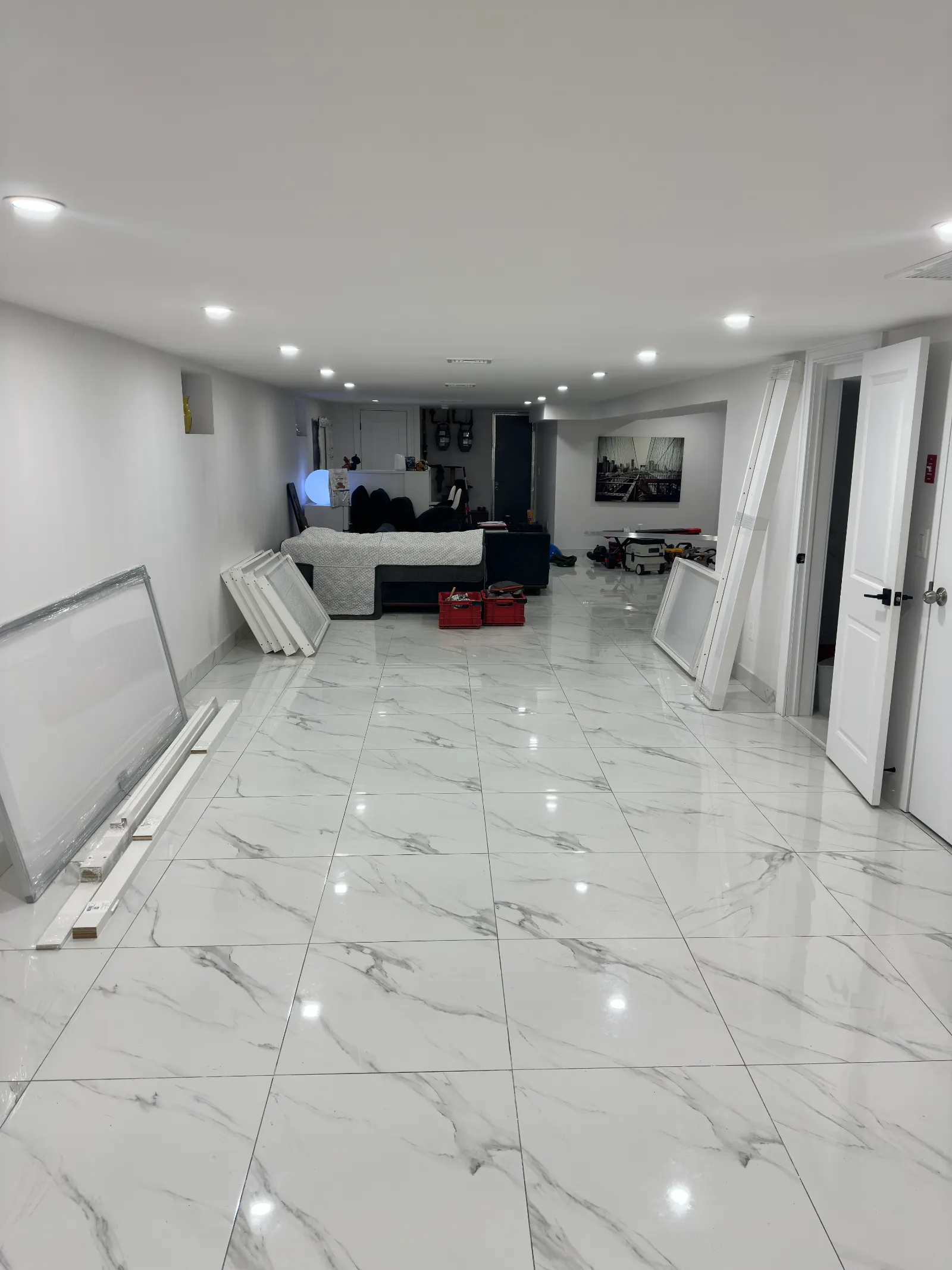 Open finished basement before the temporary basement wall install &mdash; one long undivided space