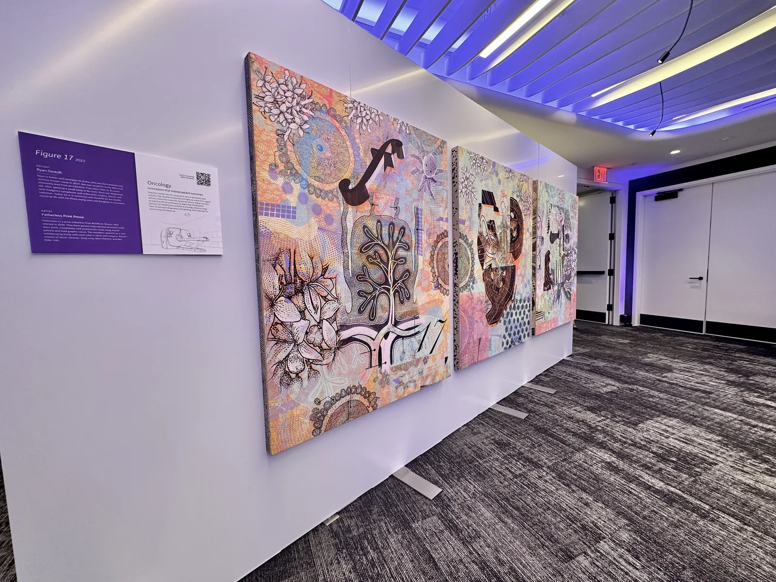 Freestanding white display walls holding large art canvases at the GE HealthCare art showcase in Nasdaq&rsquo;s event space, NYC